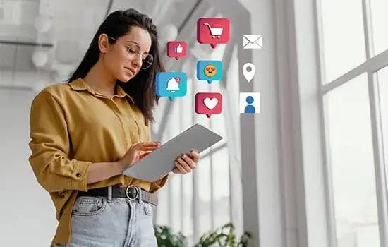 Hands holding smartphone with social media icons — AI-powered social media